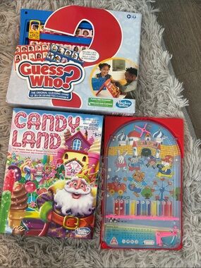 Hasbro Candy Land & Guess Who? Game Boxes with Red Handheld Pachinko